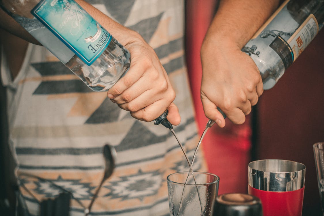 a bartender mixing alcoholic drinks