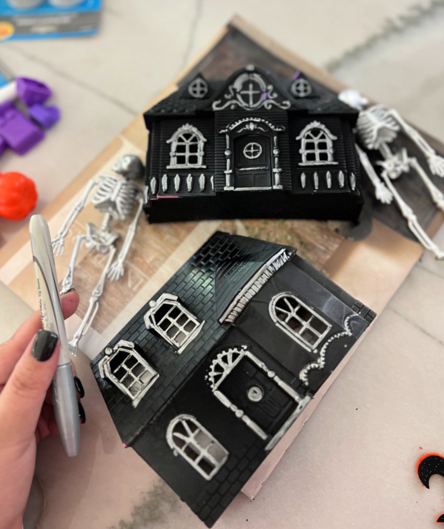 using a silver sharpie to decorate dollar tree diy halloween decor