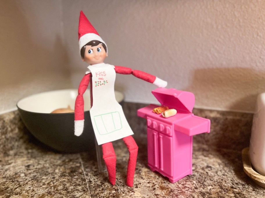 elf cooking on bbq, one of our dollar tree elf on a shelf ideas