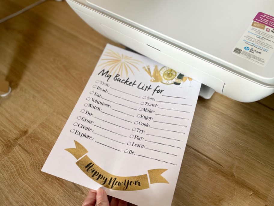 new years bucket list printable coming out of the printer
