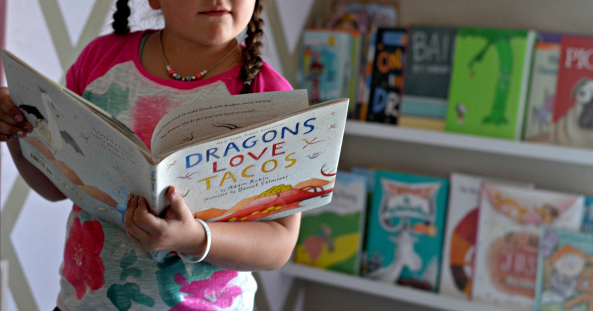 little girl reading a book