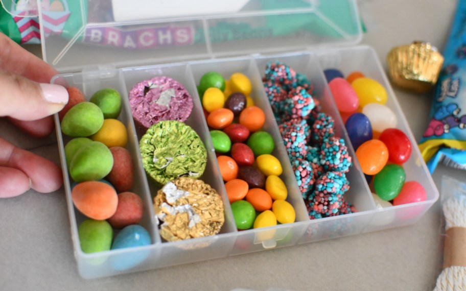 snackle box with rainbow M&Ms, skittles, reese's, nerds gummies, and jelly beans