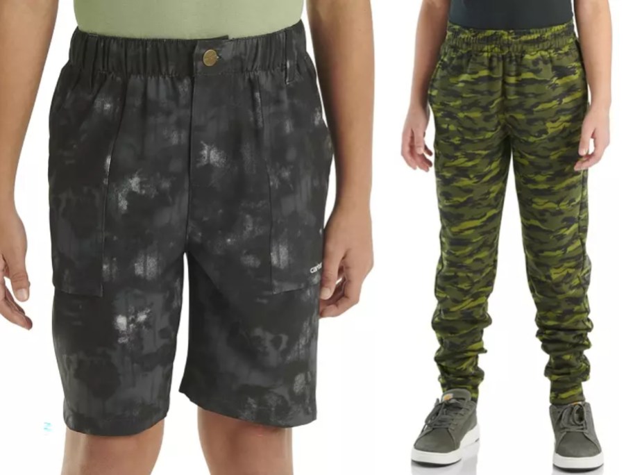 boy wearing black print shorts and boy wearing camo joggers