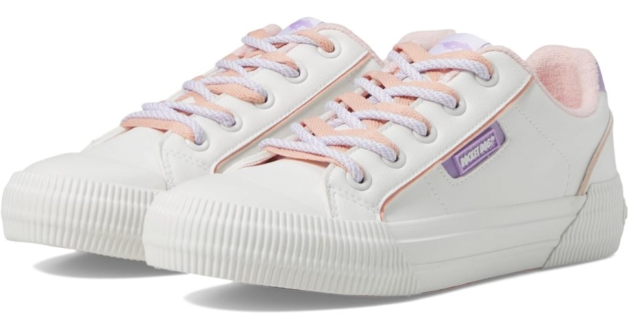 a pair of women's white low top sneakers with pink and purple accents