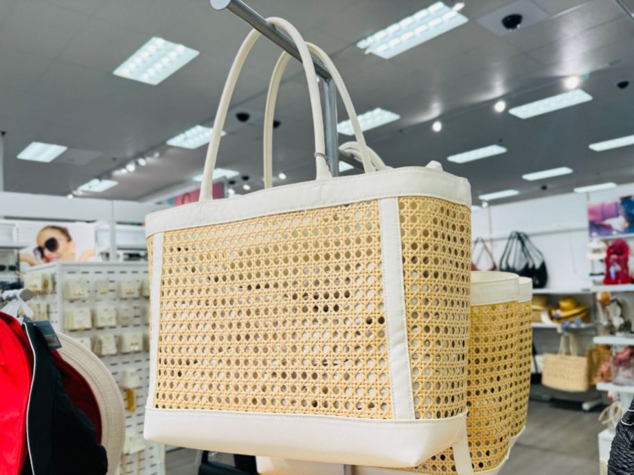 A New Day Caning Tote Handbag hanging in store