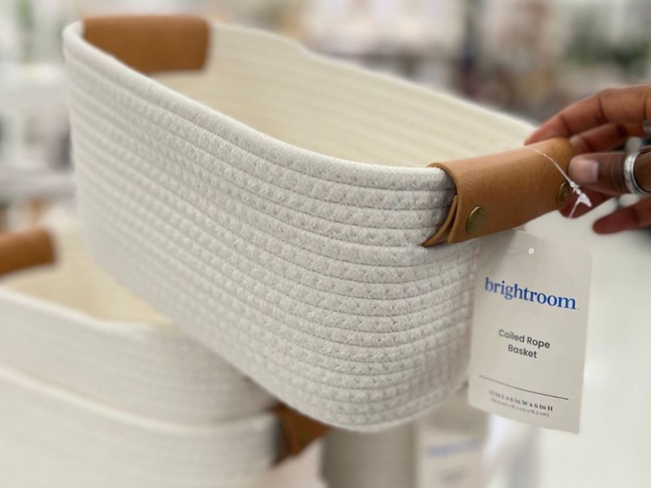 Hand touching a Brightroom Coiled Rope Basket