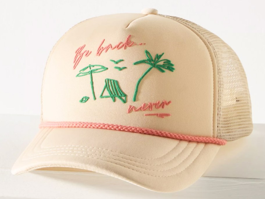 white and pink trucker hat that says be back never