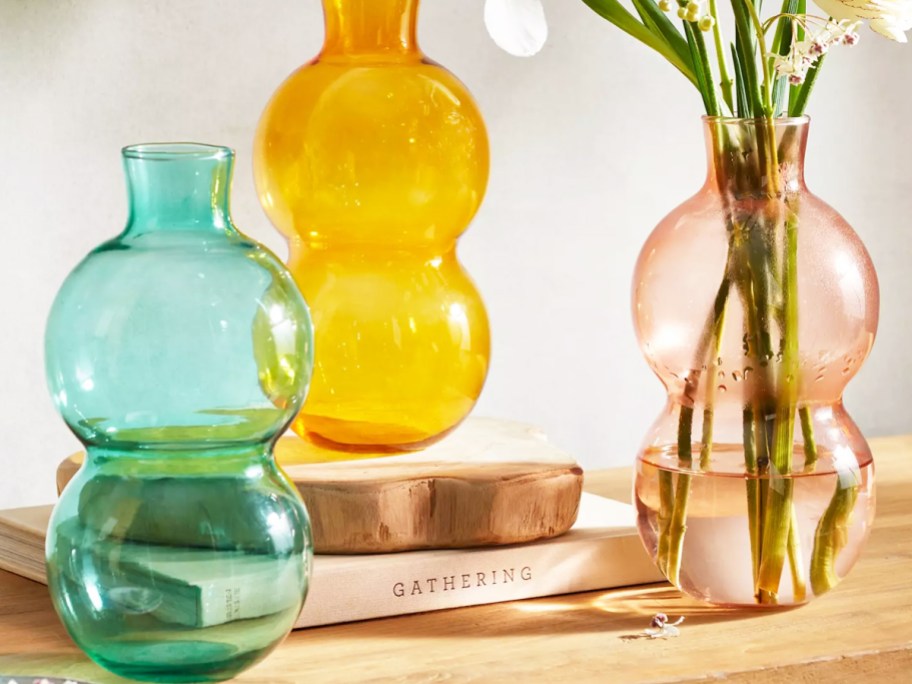 teal, yellow, and pink glass bubble bud vases