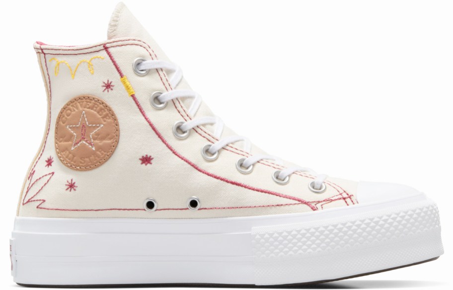 white embroidered platform converse shoe