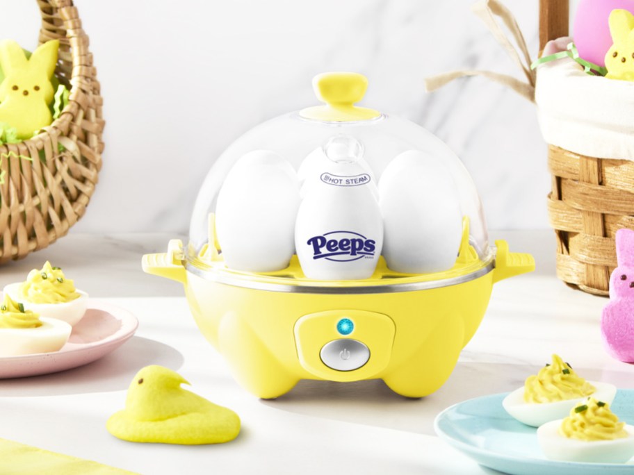 yellow egg cooker with easter peeps all around it