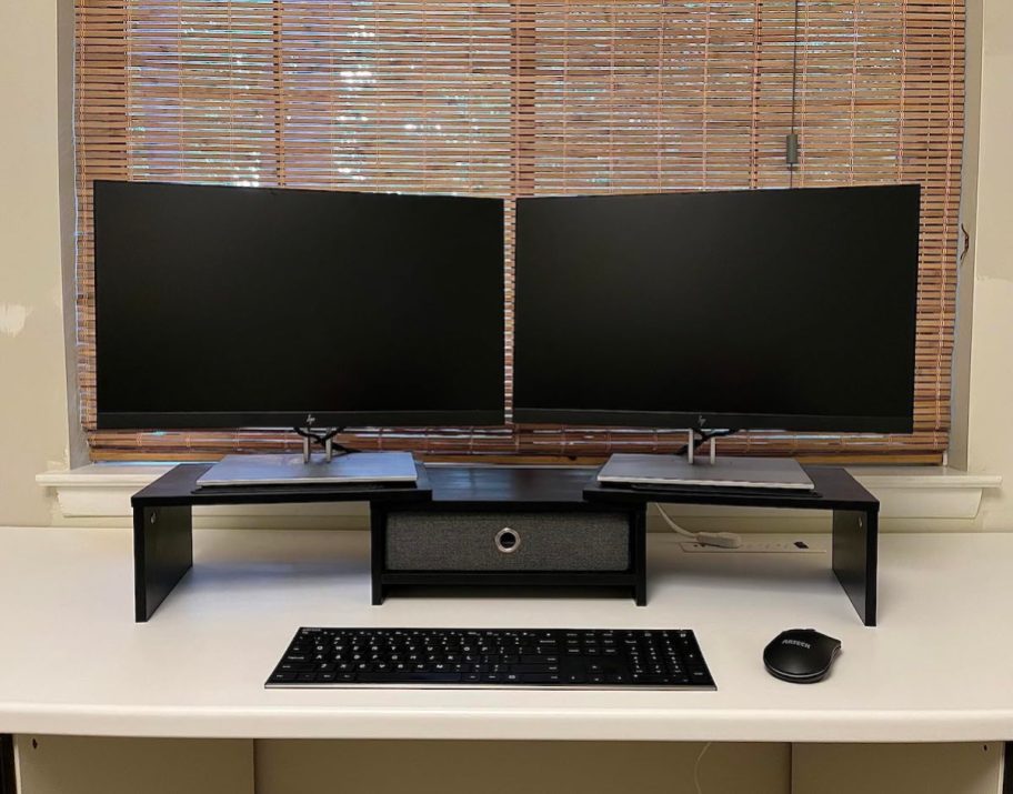 two monitors on computer desk