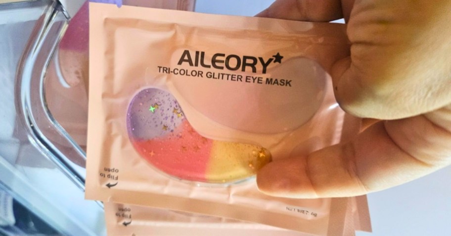 hand holding individual packs of Aileory Under Eye Patches