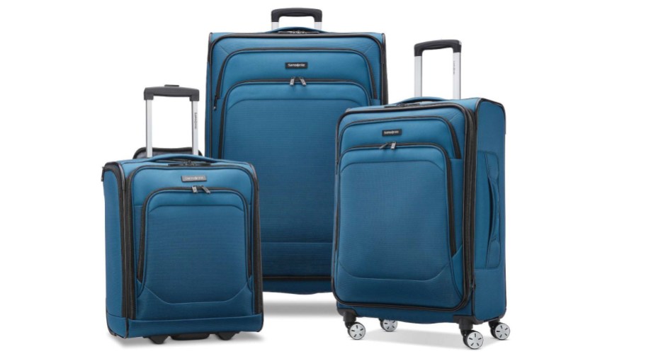Three kohls luggages stacked in front of eachother in blue