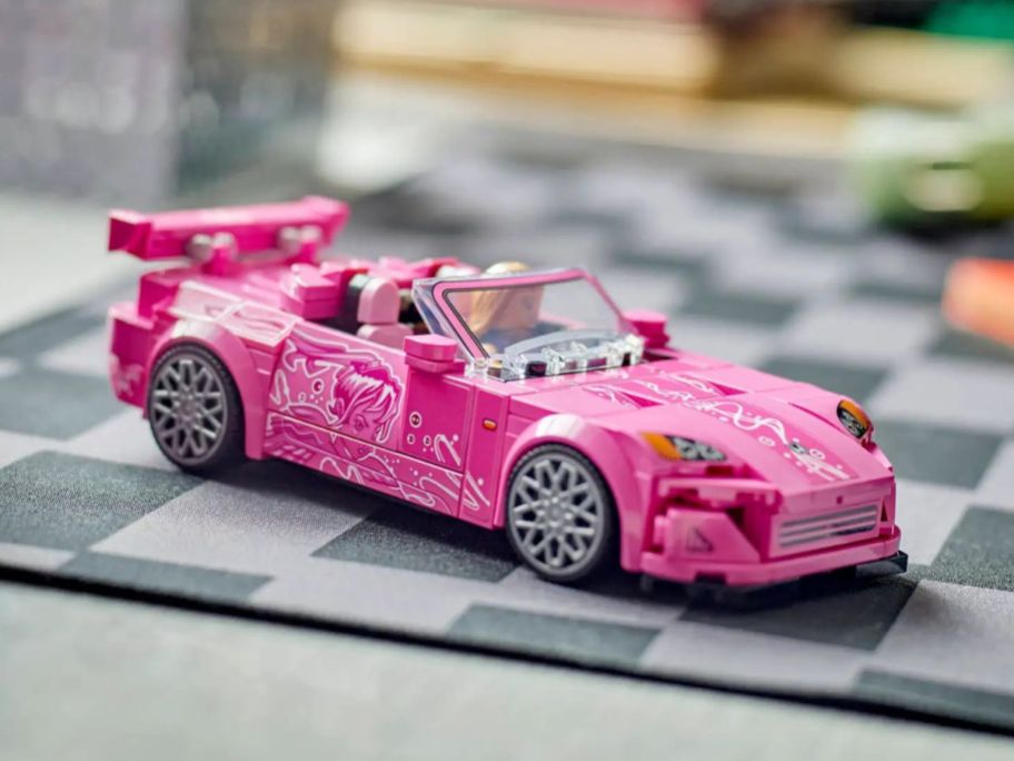 A pink LEGO 2 Fast 2 Furious Honda S2000 car