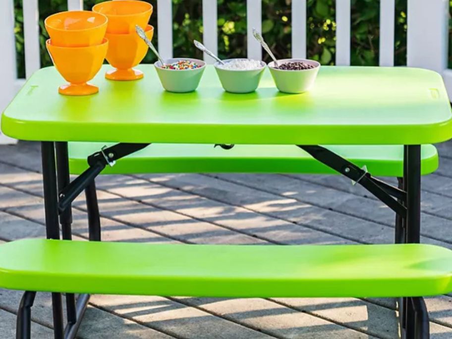 A lime green Lifetime Kids Picnic Table