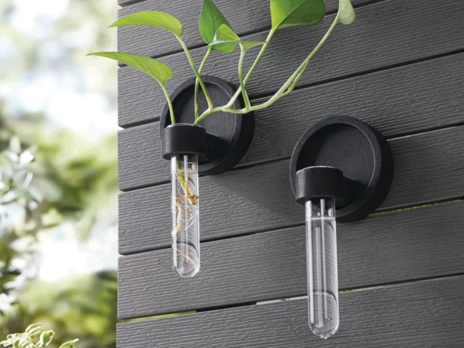 2 hanging propagation stations on the side of a house