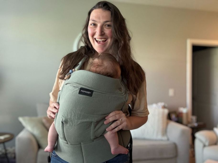 woman holding baby in Momcozy Carrier