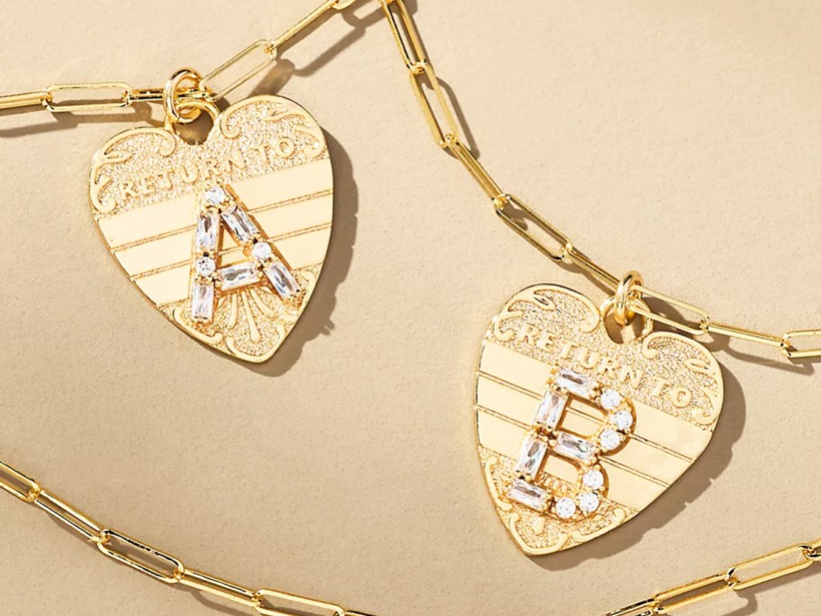 two gold heart monogram necklaces