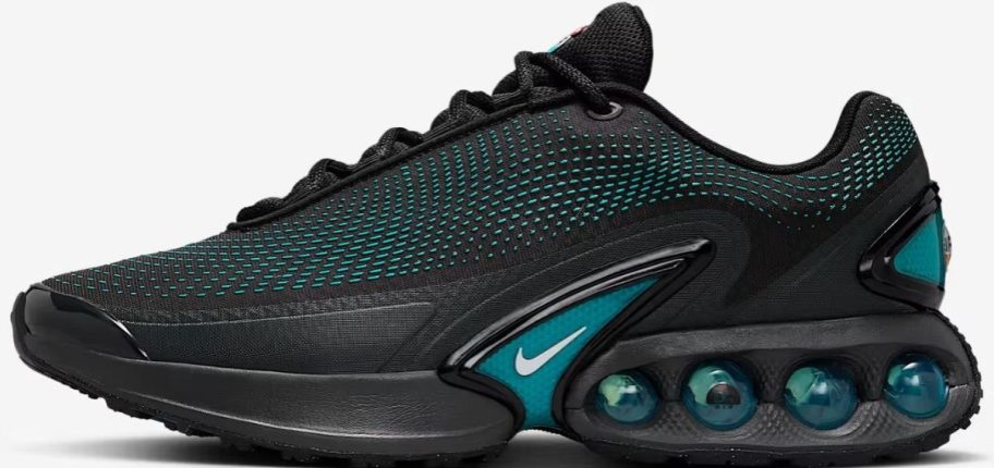 A black, and teal green mens Nike running shoe