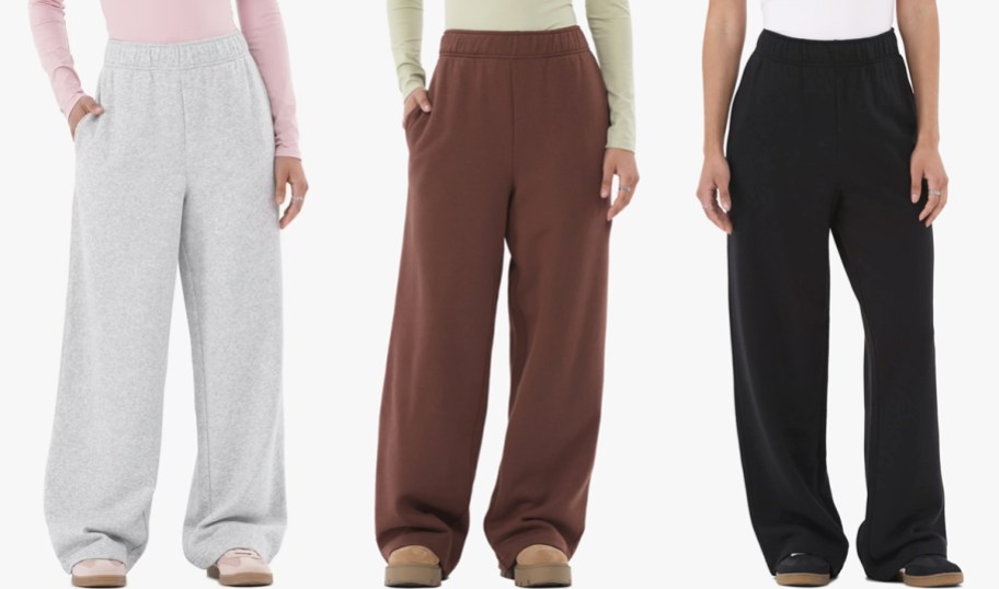 three women in grey, brown, and black sweatpants