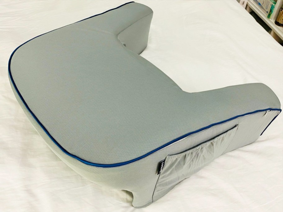 grey lap desk pillow on bed
