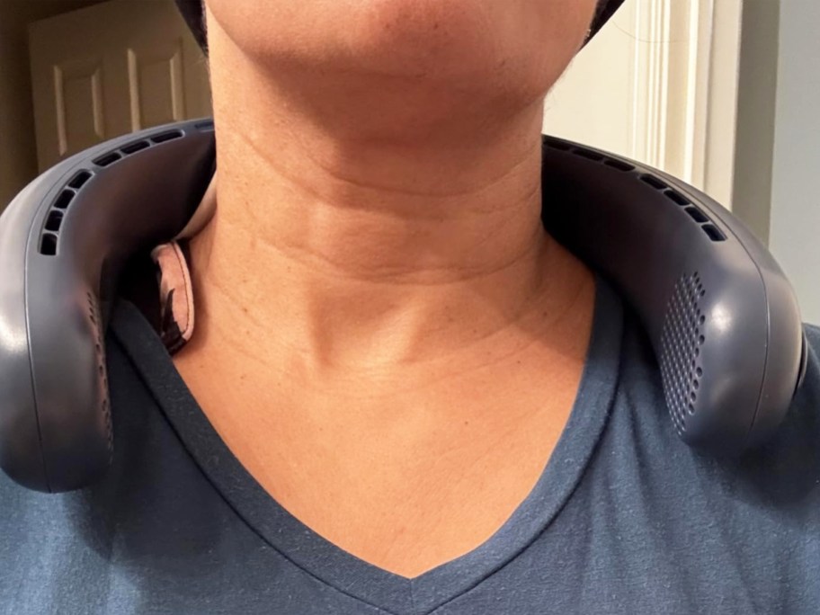woman with a navy blue neck fan around her neck