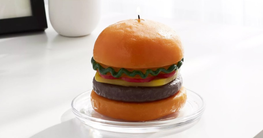 hamburger shaped candle on a plate