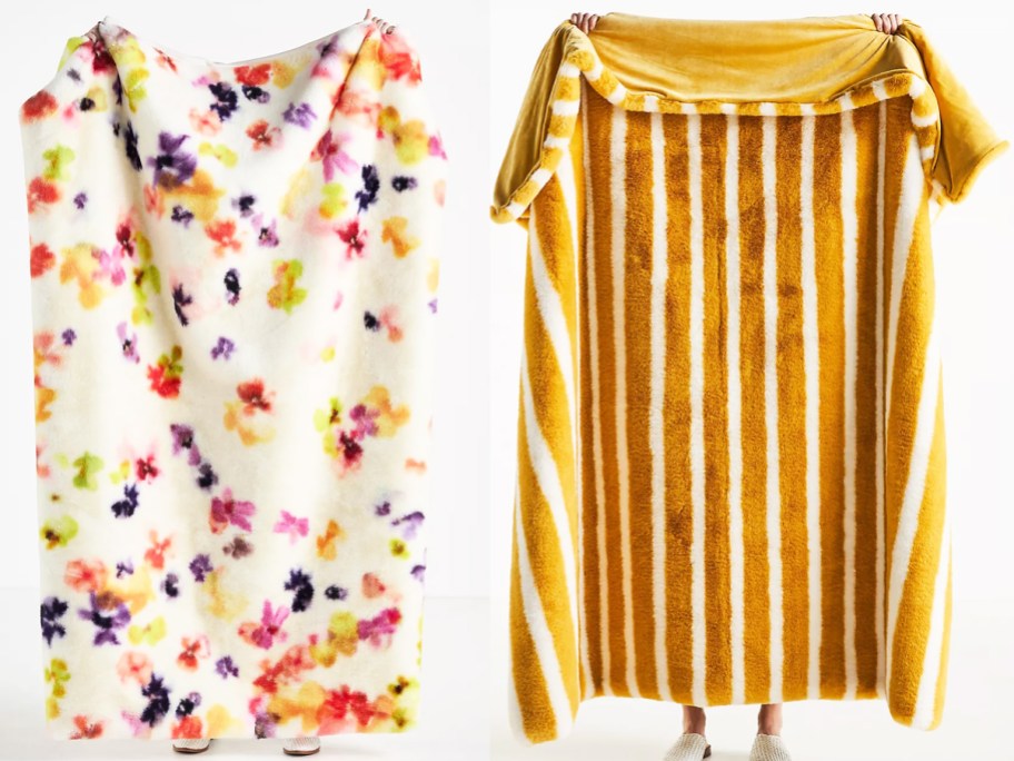 two women holding up floral print and yellow striped fur throw blankets