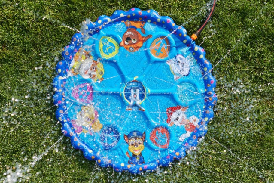 paw patrol splash pad displayed with water on the grass