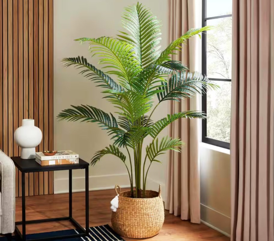 green faux palm tree in basket in living room