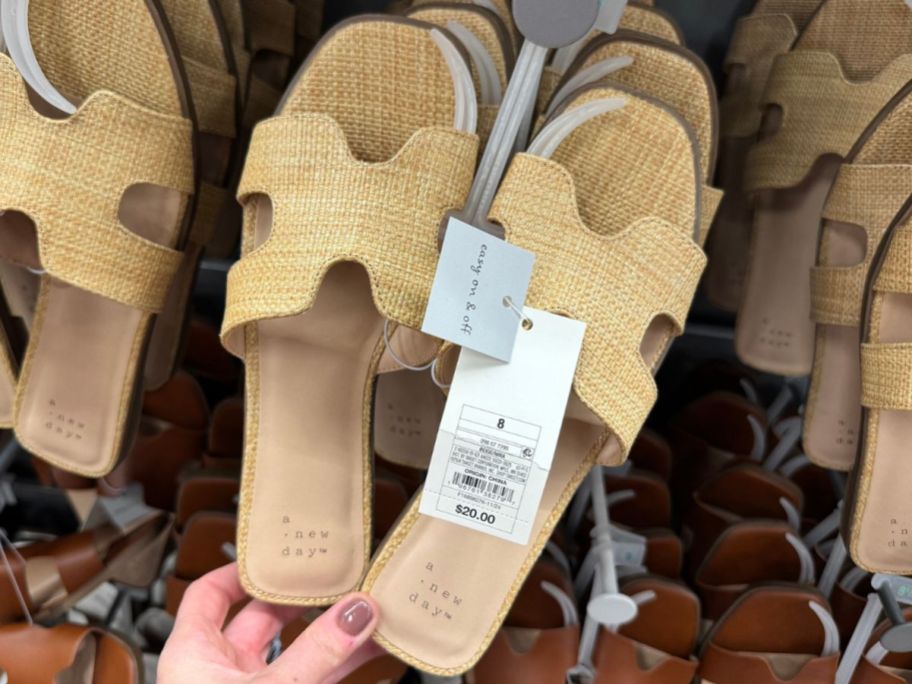 Hand touching a pair of A New Day Women's Nina Slide Woven Sandals 