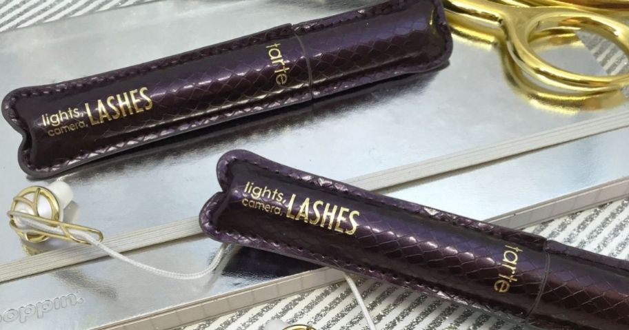 two purple tubes of Tarte Lights, Camera, Lashes Mascaras
