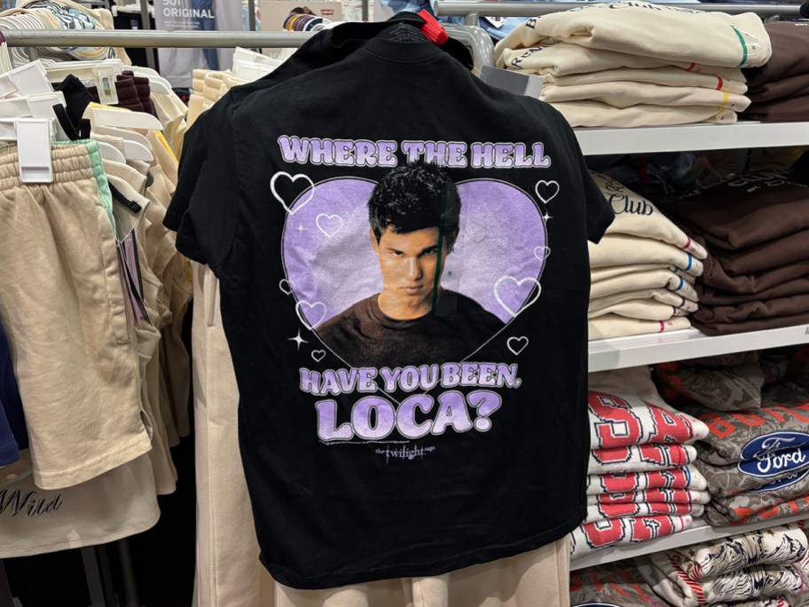 Black Twilight graphic T-shirt at Target featuring Jacob Black and the quote “Where the hell have you been, loca?” displayed on a clothing rack.