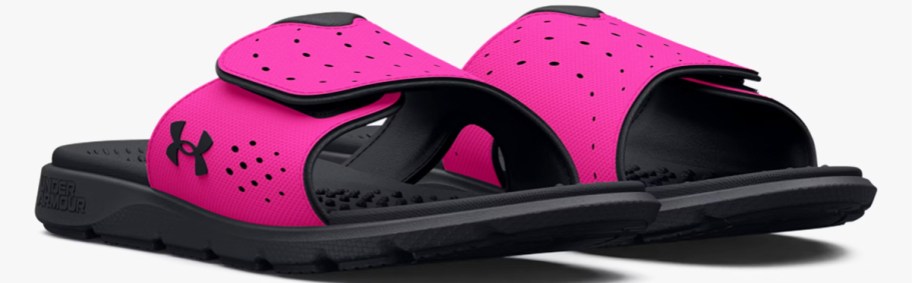 pair of pink and black under armour slides