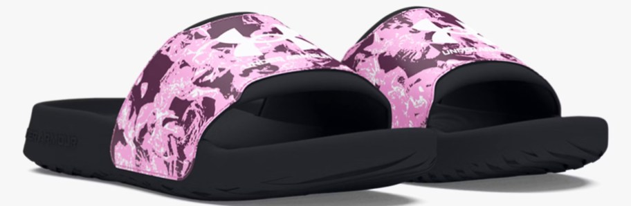 pair of black slides with pink straps