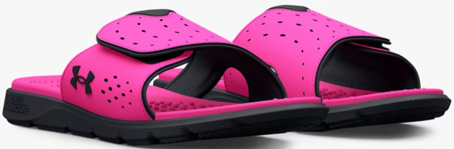 pair of pink and black under armour slides
