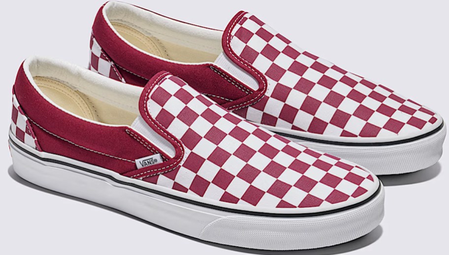 pair of red and white checkerboard sneakers