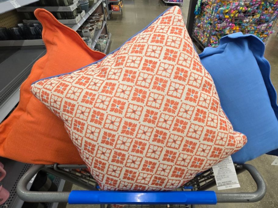 A walmart cart with Mainstays by Becky G. & Alejandra Decorative Pillows in it