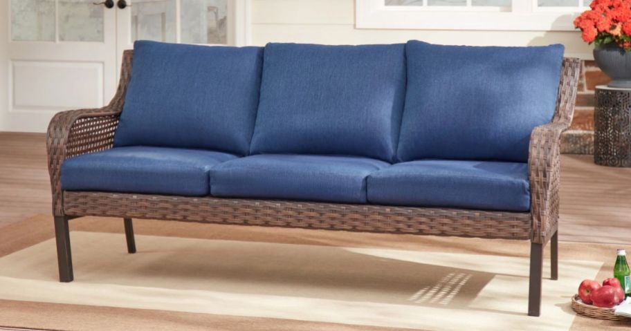 Mainstays Tuscany Ridge Wicker Outdoor Sofa with blue cushions