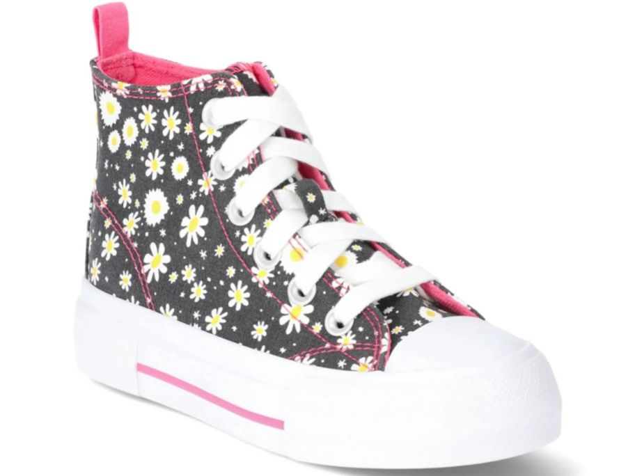 A black high top sneaker with daisies on it 
