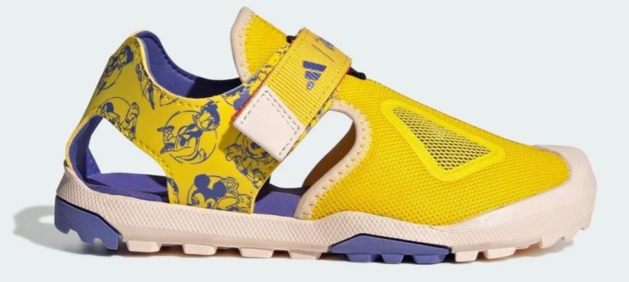 yellow and blue adidas Kids Disney Mickey & Friends Terrex Captain Toey 2.0 Sandal stock image