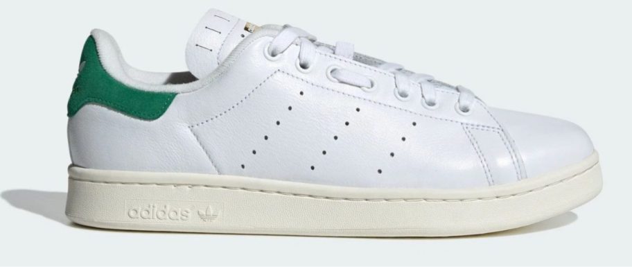 white and green adidas Men's Velostan Smith Shoe stock image