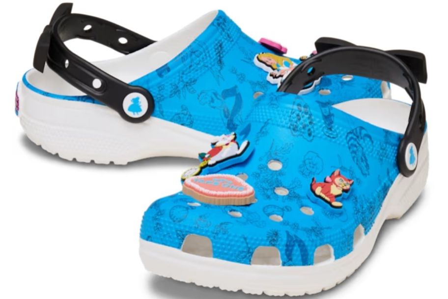 a pair of alice in wonderland themed crocs with jibits