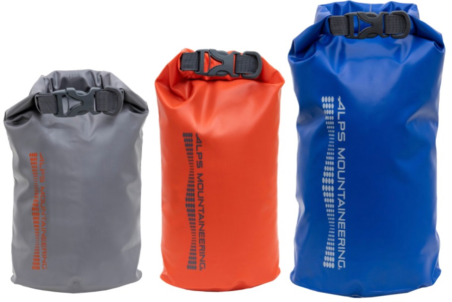 gray, red, and blue dry bags