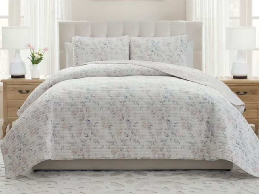 My Texas House Rebecca 2-Piece Floral Reversible Quilt Set on bed in bedroom