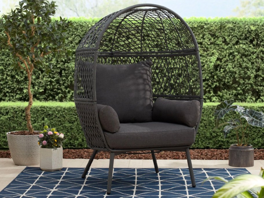black egg chair on patio 