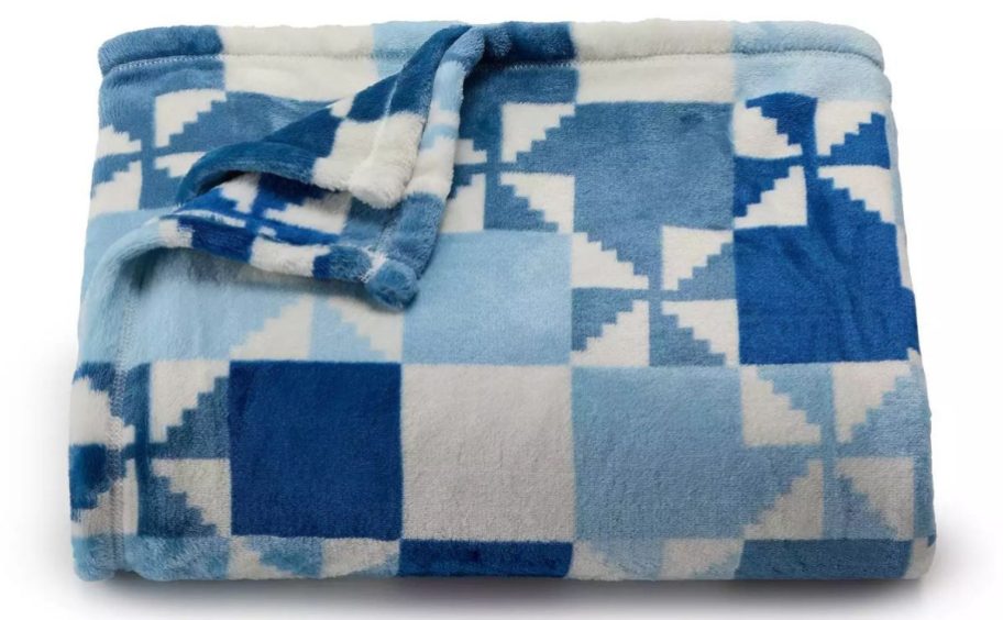 blue and white patterned The Big One Oversized Supersoft Plush Throw Blanket stock image