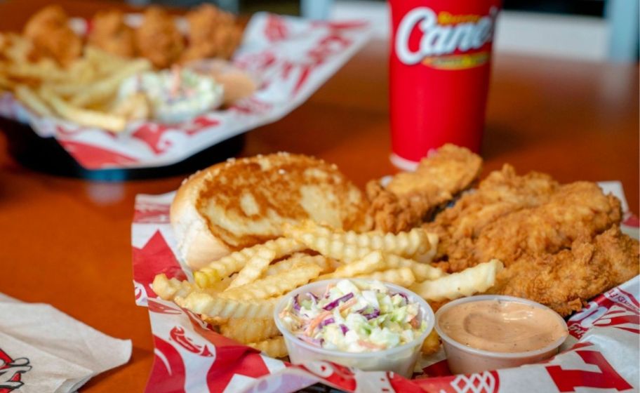 a canes box combo with drink in a basket on a tabletop