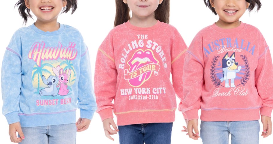 three girls wearing stitch, rolling stone, and bluey pullovers
