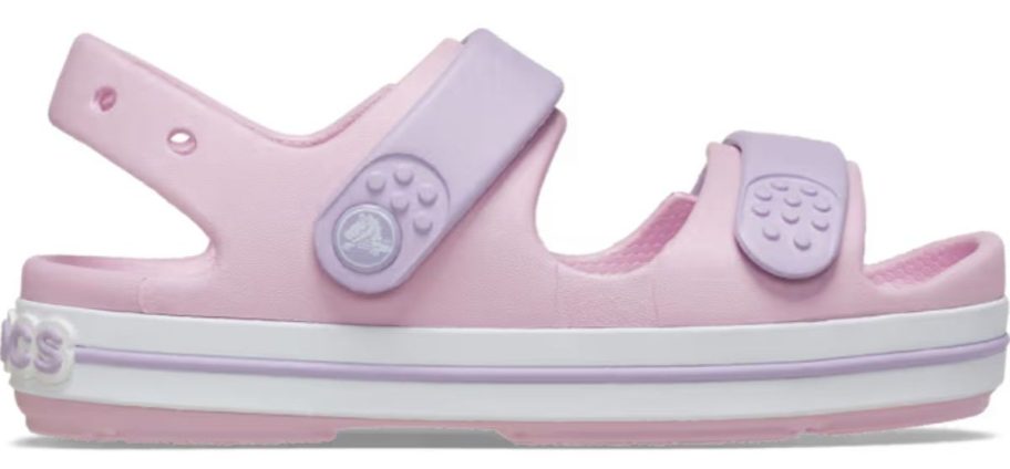 pink and purple Crocs Kids' Crocband Cruiser Sandal stock image